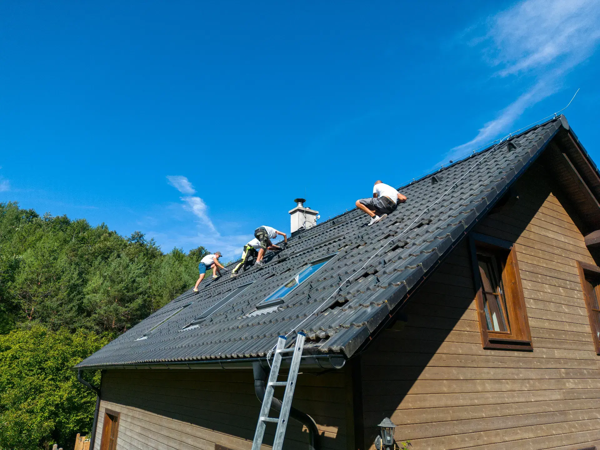 Roofer documenting storm damage for an insurance claim in New York